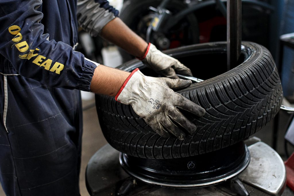 A technician mounts tires: Leaving your seasonal tires on their own rims helps you save money on winter tires in the long run. Winter tires replacing in compliance to Covid-19 rules during COVID-19 pandemic in Italy on April 30, 2020 in Fabbrico, Italy. (Photo by Emmanuele Ciancaglini/NurPhoto via Getty Images)