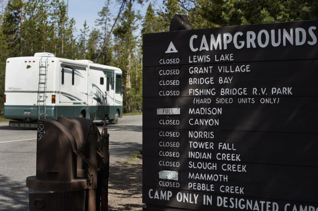 A sign showing full campgrounds in the wake of Yellowstone's re-opening