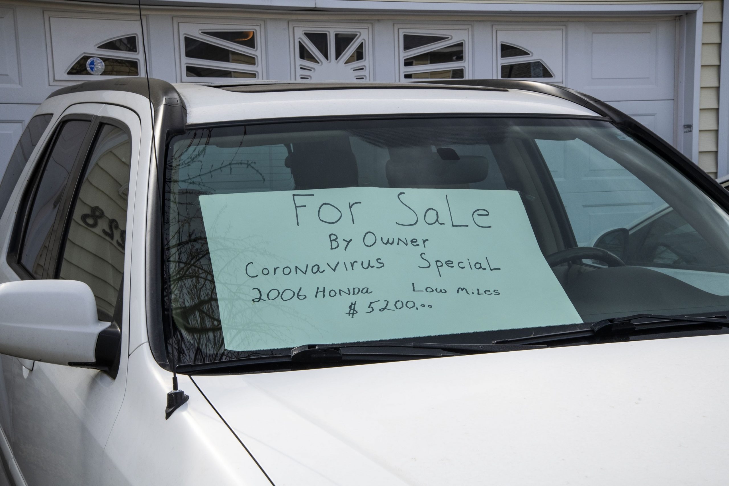 A for sale sign in the window of a vehicle