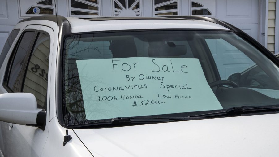 A for sale sign in the window of a vehicle