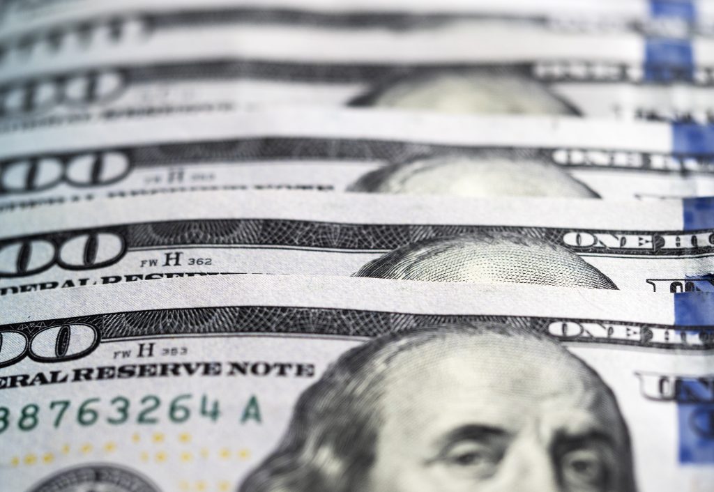 A stack of hundred dollar bills