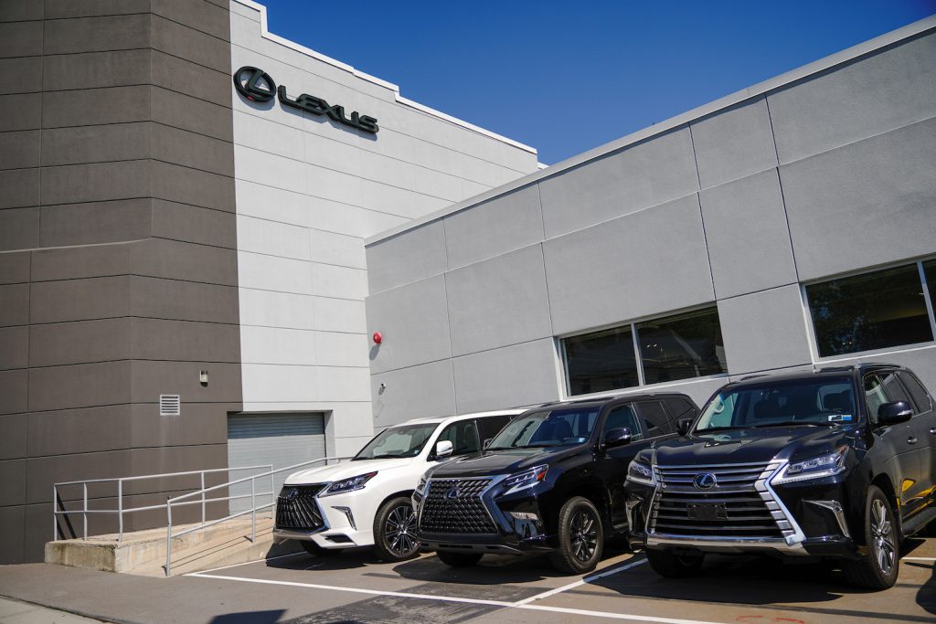Three 2020 Lexus SUVs outside a Lexus dealership. Not pictured: the 2022 Lexus LX