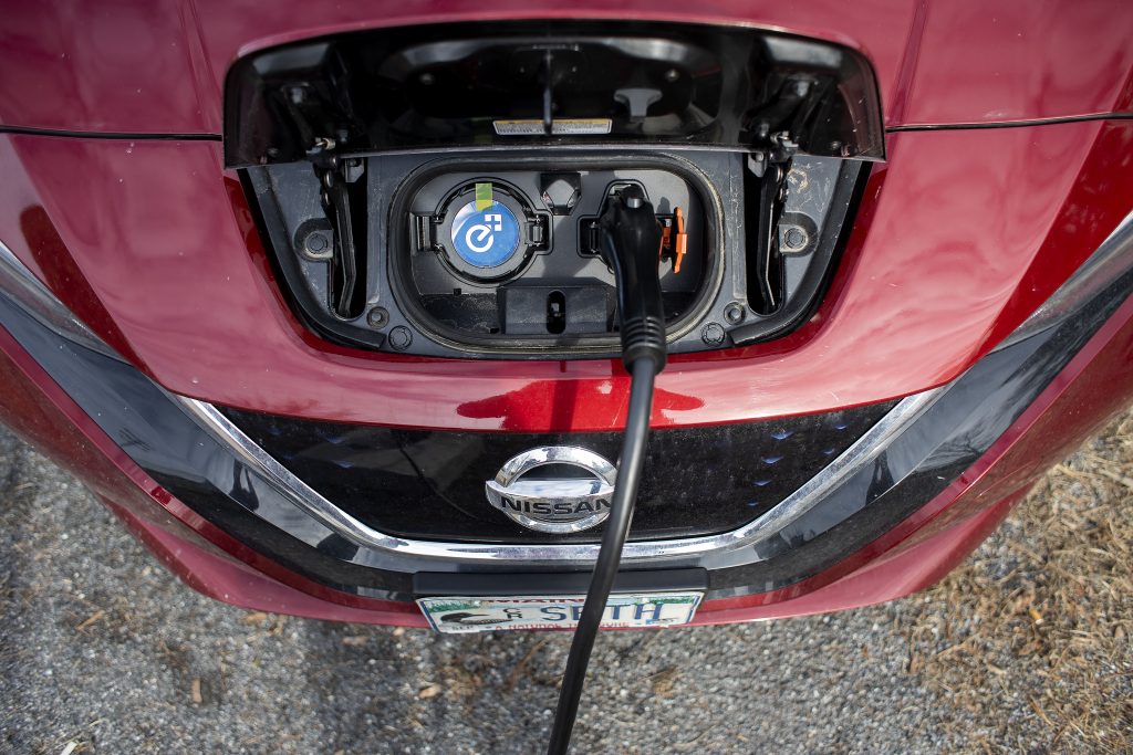 A Nissan Leaf photographed from above while charging