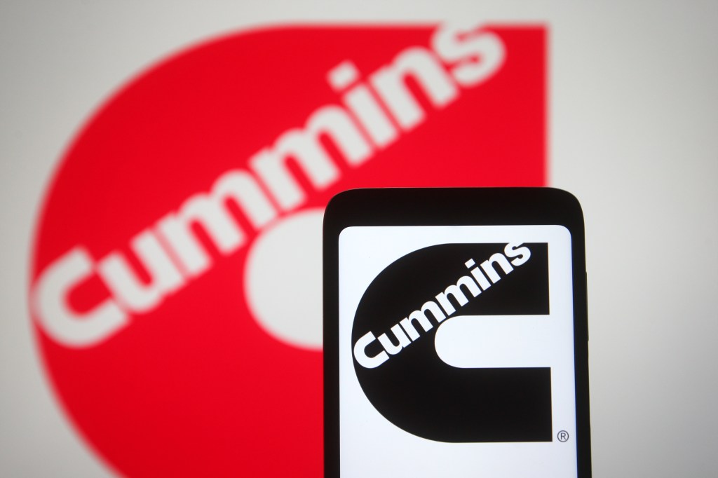 The red cummins diesel logo with a smart phone also displaying the logo in black and white