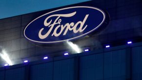 The blue oval Ford Motor Company logo on the side of a Ford truck factory