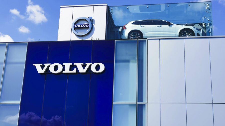a Volvo building with the logo and a display car