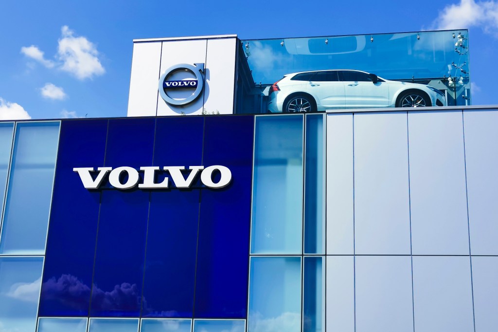 a Volvo building with the logo and a display car