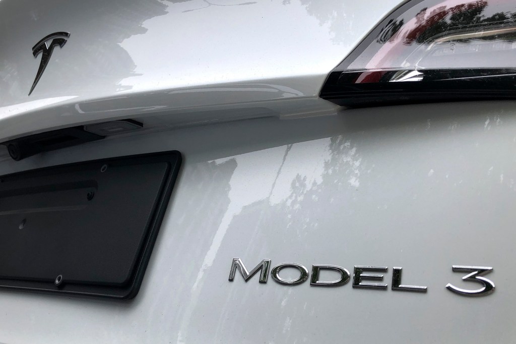 The "Model 3" badge seen on a white Tesla