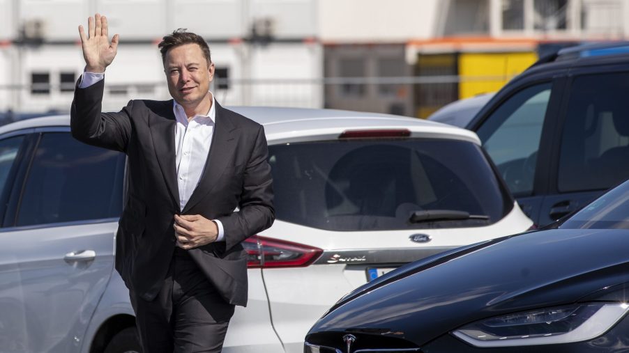 Elon Musk waves to photographers in Germany