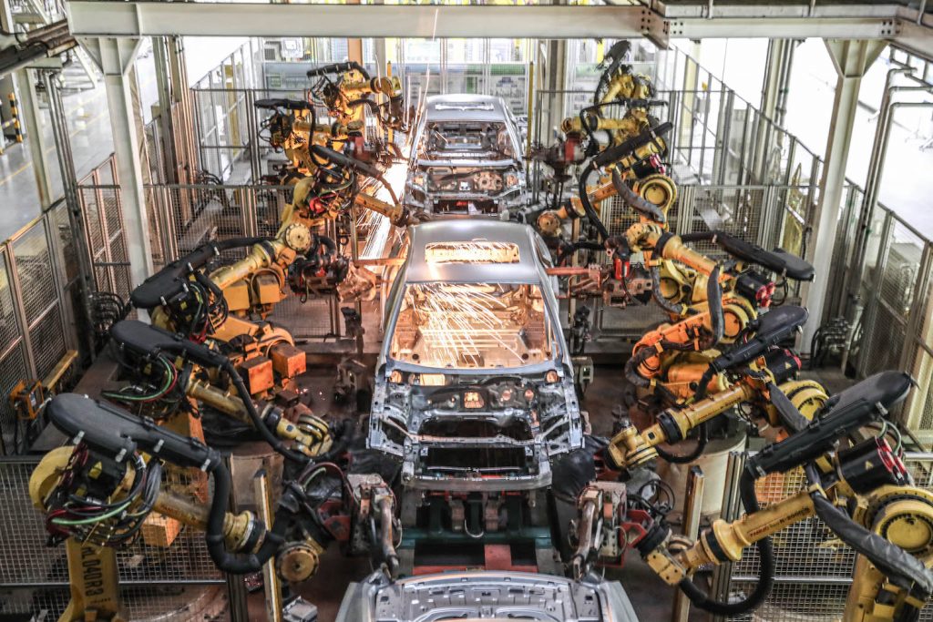 SHENYANG, CHINA - DECEMBER 18: Robotic arms operate on the vehicle assembly line at a factory of Shanghai GM (Shenyang) Norsom Motors Co. Ltd on December 18, 2020 in Shenyang, Liaoning Province of China. (Photo by VCG/VCG via Getty Images). Chevy Bolt Recall: May Affect Hummer EV and Cadillac LYRIQ