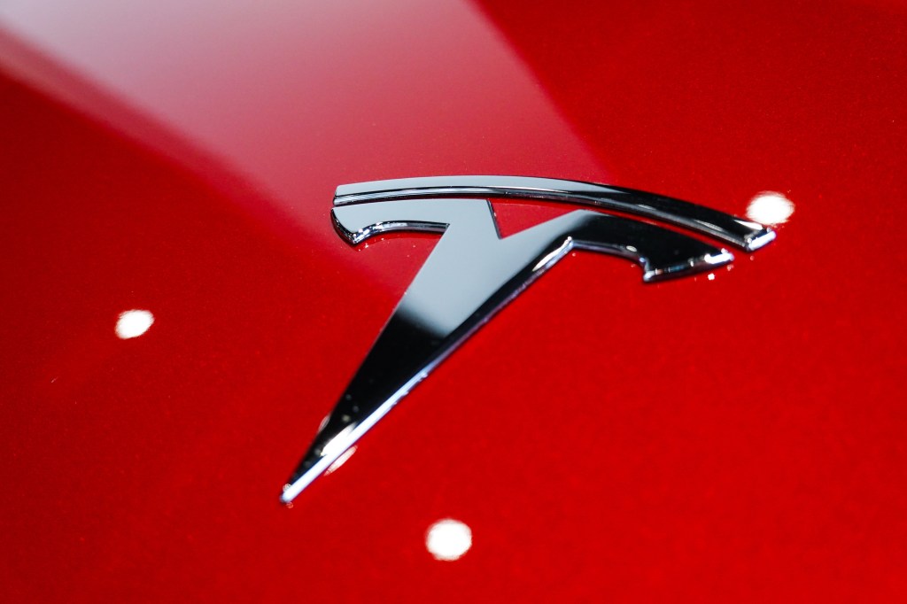 Tesla's logo on the hood of one of their cars