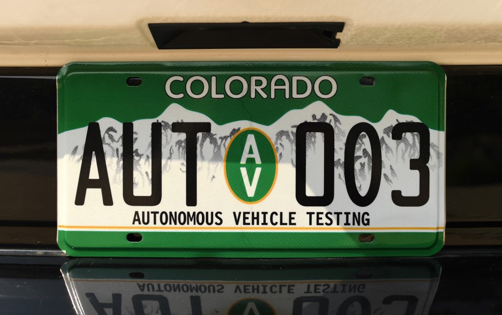 A special Colorado license plate with the text "autonomous vehicle testing"