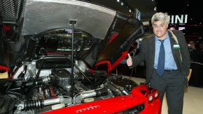 Jay Leno gives a red Ferrari Enzo a thumbs-up at the Detroit auto show, so why doesn't Jay Leno own a single Ferrari?