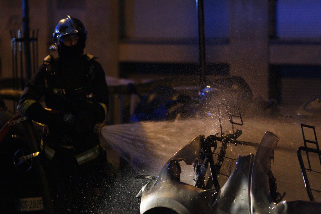 A firefighter puts out an electric vehicle battery fire in France