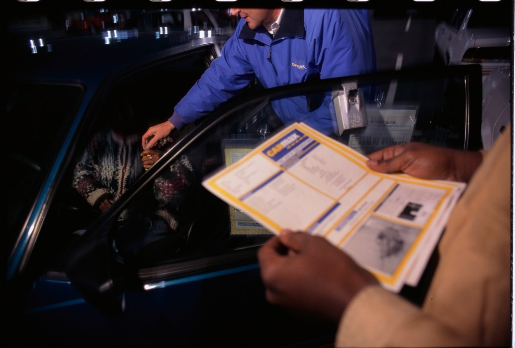 CarMax Salesman Handing Car Keys to Woman