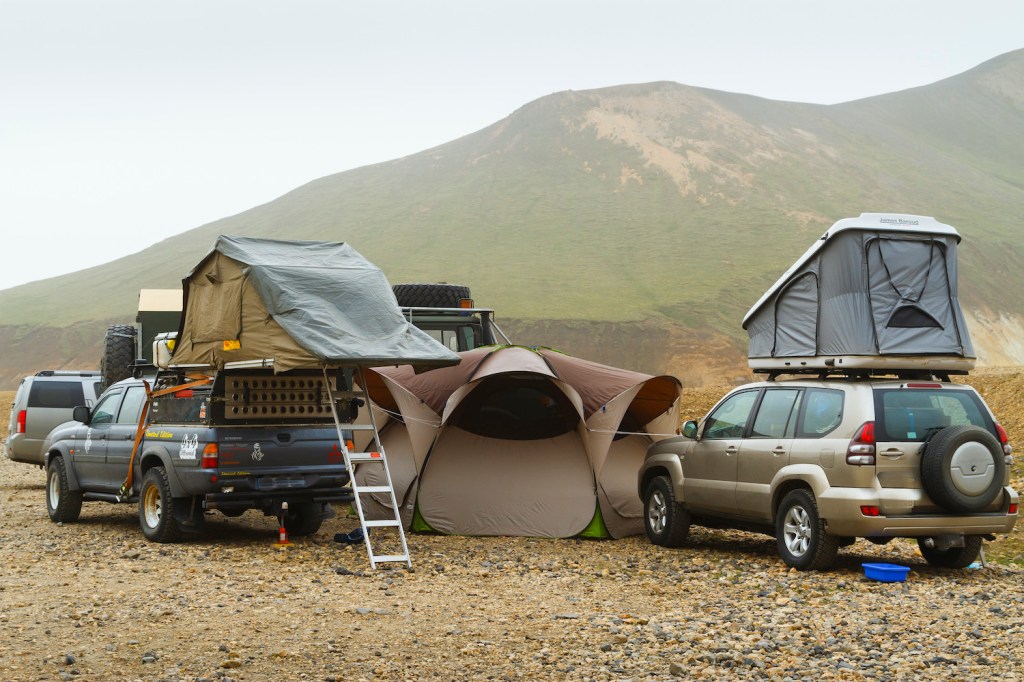 Overland Camping Shelter Options: Overlanders use both softshell and hardshell rooftop campers while exploring Landmannalaugar. Iceland. (Photo by: Mikel Bilbao/VW PICS/Universal Images Group via Getty Images)