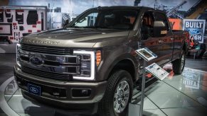 A Ford F-350 Super Duty truck on display at an indoor auto show