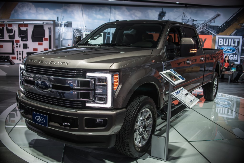 A Ford F-350 Super Duty truck on display at an indoor auto show