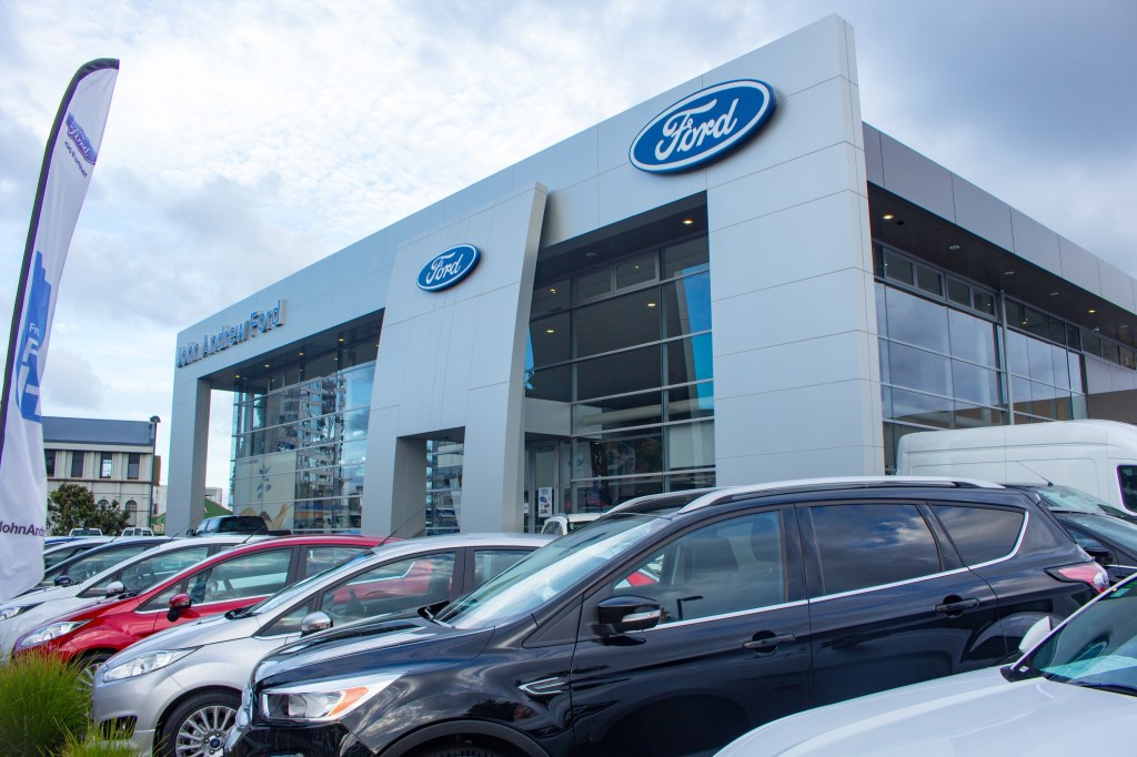 A Ford dealer with models lined up out front