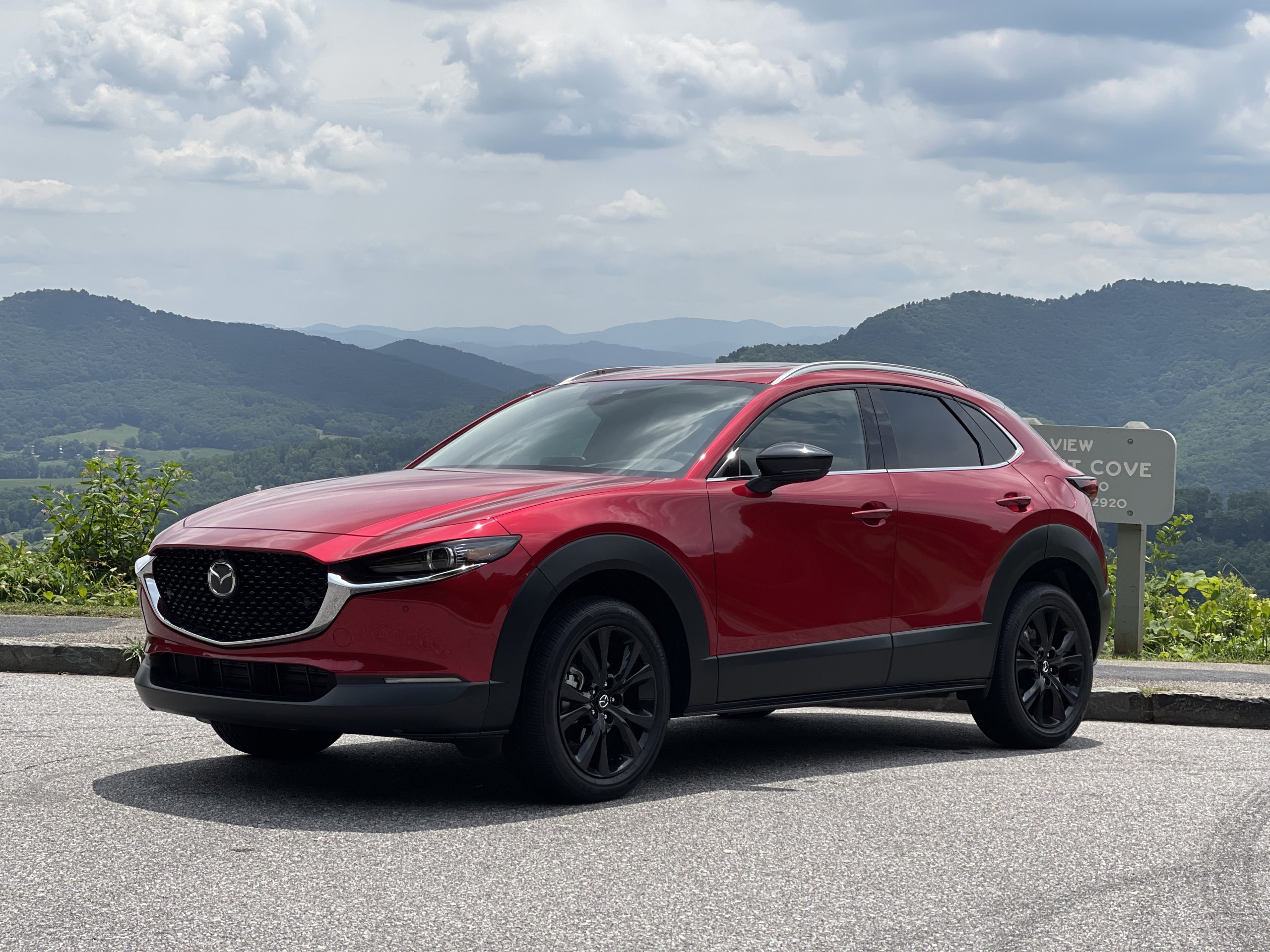 The 2021 Mazda CX-30 Turbo parked in front of a mountain view