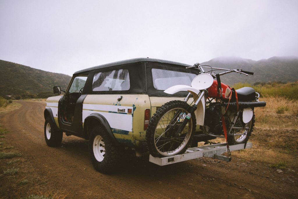 Scout II with a dirt bike mounted to the back