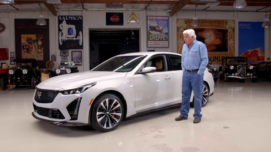 Jay Leno in his garage with a white 2022 Cadillac CT5-V Blackwing