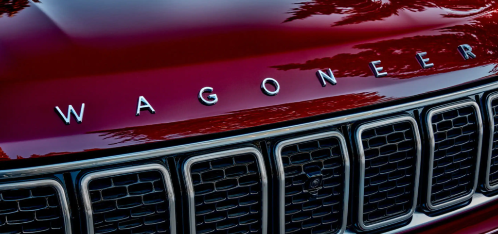 The Jeep Wagoneer and model lettering above the grille with a red paint color option
