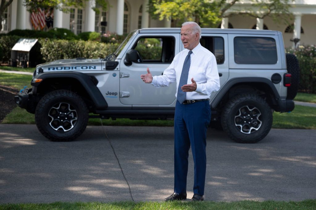 President Joe Biden speaking to reporters outside of the White House near a Jeep Wrangler 4xe model