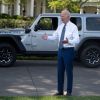 President Joe Biden speaking to reporters outside of the White House near a Jeep Wrangler 4xe model
