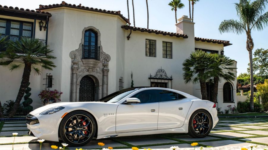 The Karma Revero GT parked in the plaza outside of a luxury villa