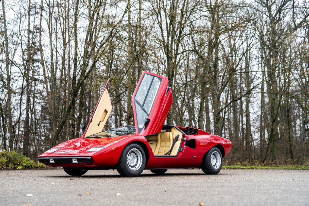 A red 1977 Lamborghini Countach LP400 with its doors raised