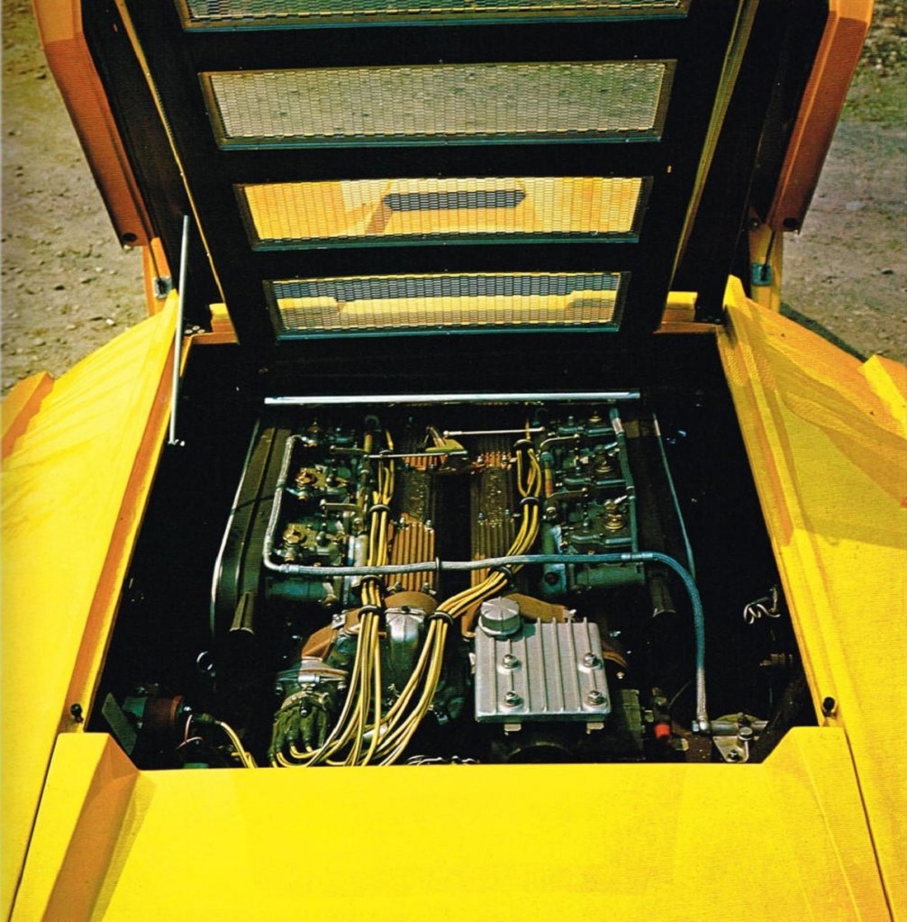 A view of the V12 engine in the rear of a yellow Lamborghini Countach