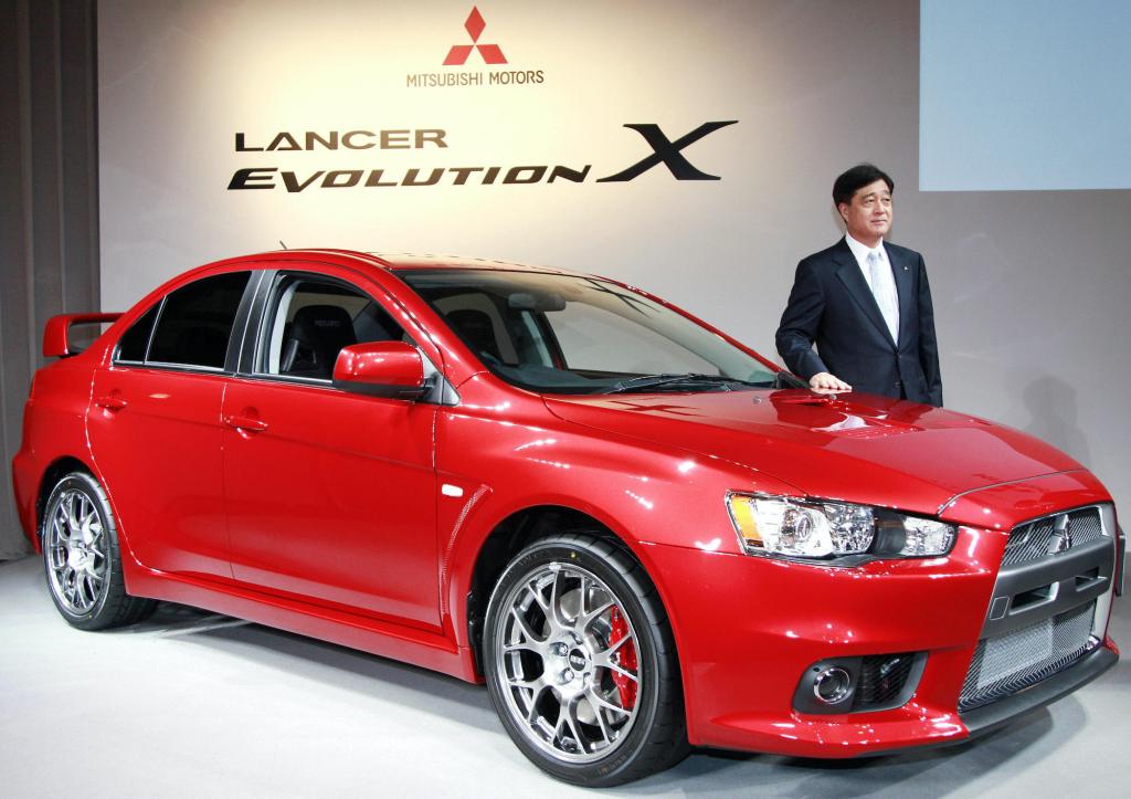 a red Mitsubishi lancer evolution on display