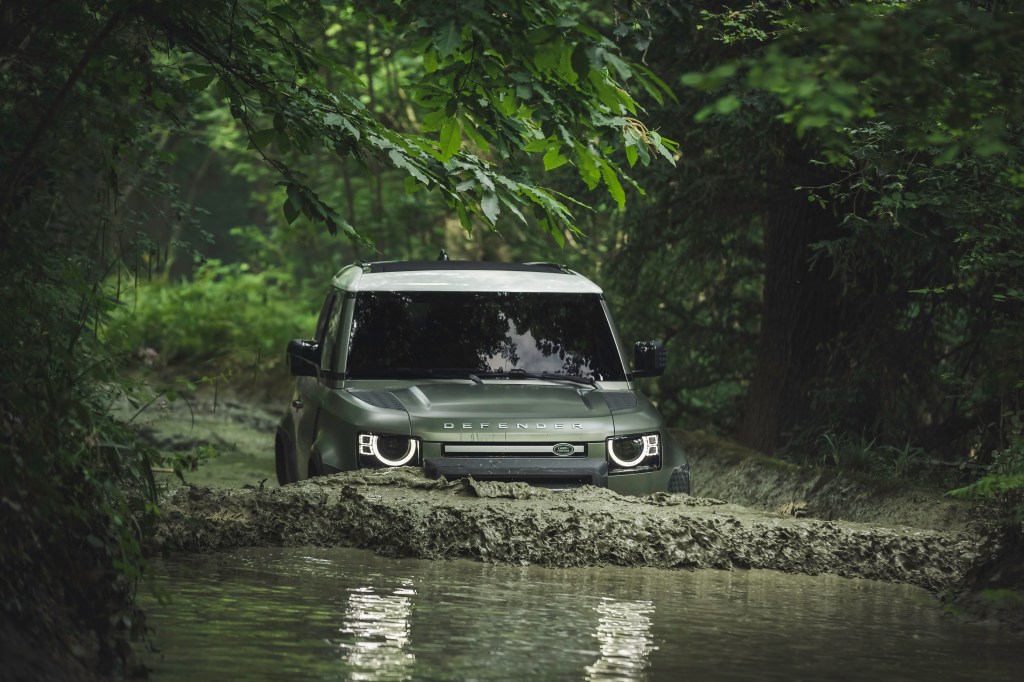 2021 Land Rover Defender 90 review takes the Defender half way underway as it fords a river