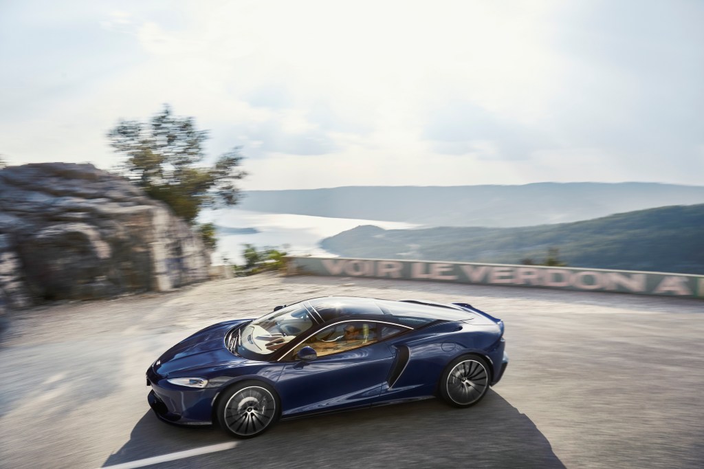 Mclaren's GT in blue on a twisty road in St Tropez