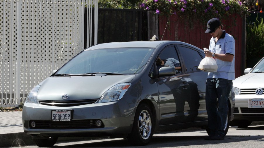 Leonardo DiCaprio getting into his Toyota Prius, one of the cheapest cars owned by one of the world's richest celebrities