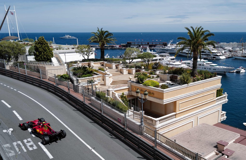 A Ferrari F1 car drives on the Circuit de Monaco race track