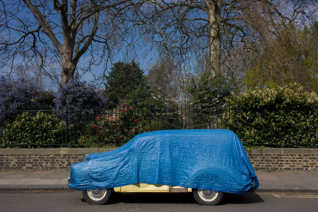 Morris Minor Classic Car Covered By Tarp