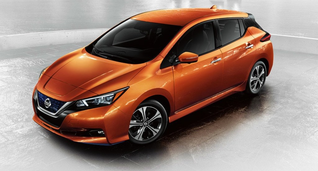 An orange Nissan Leaf.