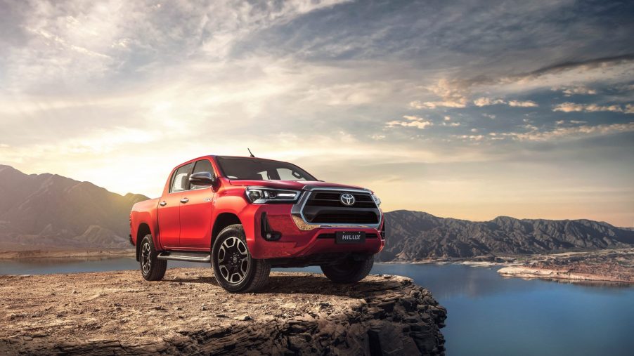 A 2021 Toyota Hilux sits on a cliffside
