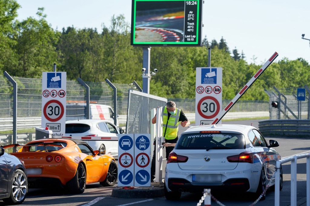 Tourist drivers enter the toll gate at Nürburgring Nordschleife race track