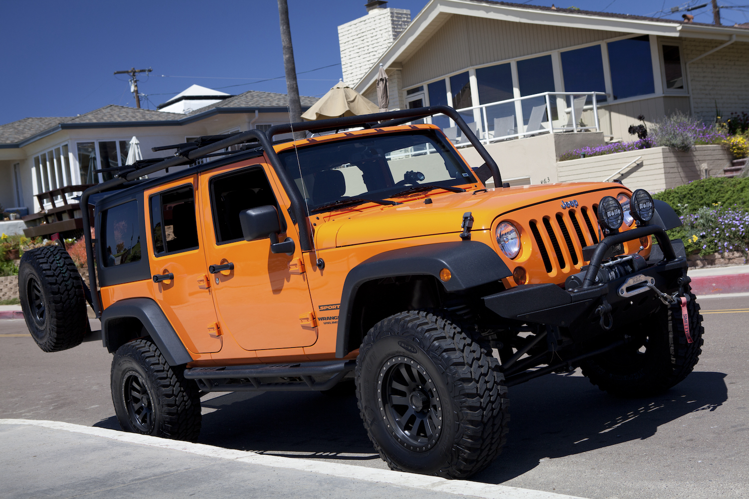 An orange Jeep Wrangler, LeBron James is one of the world's richest celebrities and once owned a Jeep Wrangler