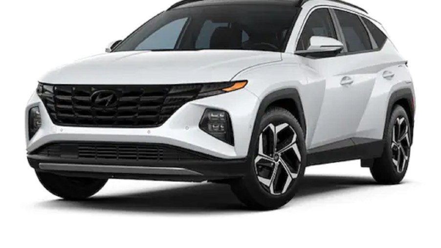 A white 2022 Hyundai Tucson against a white background.