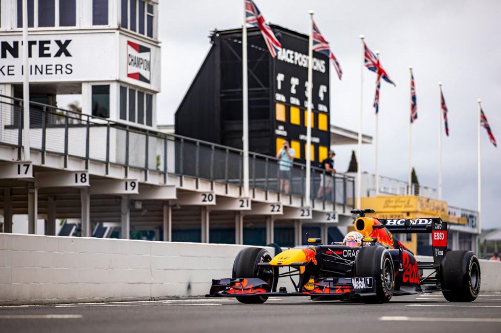 The RB7 car from Red Bull's F1 racing team parked on a race track.