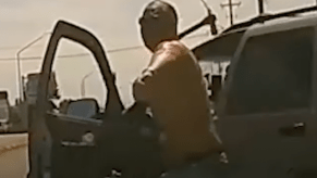 Man Throwing Pickaxe At Windshield