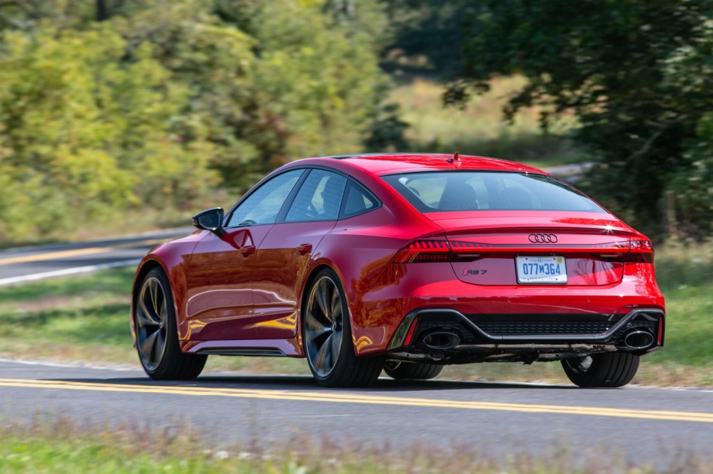 Press photo of a red 2021 Audi RS7 cornering, one of Car and Driver's most beautiful sedans of 2021