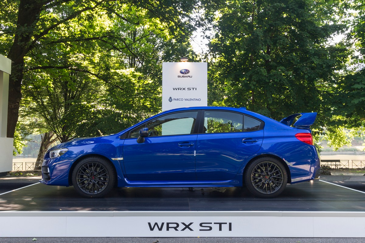 A side view of a blue WRX STI.