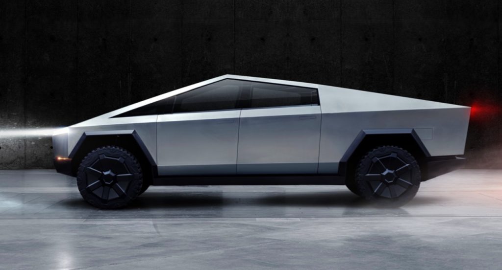 A silver Tesla Cybertruck electric pickup truck. 