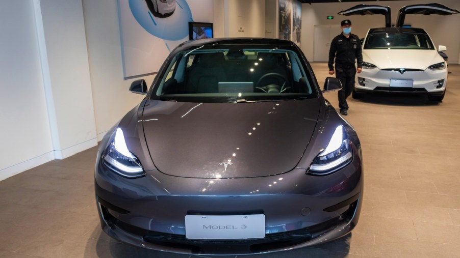 A Tesla Model 3 car and a Tesla Model X vehicle are seen at the first Tesla Center in Shanghai