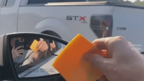 Throwing cheese slices at cars